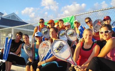 dancers-in-bleachers-tennis-rackets